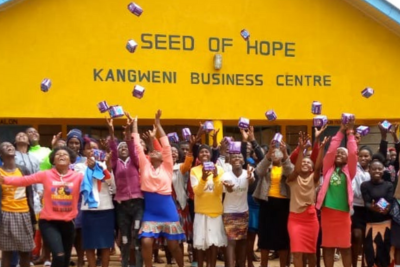 Girls throwing period packs